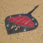 Public art: Stingray shapes on the pavement.